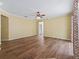 Large living room with neutral walls, wood floors, and ceiling fan at 3556 Creek Run Ln, Eustis, FL 32736