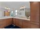 Double vanity bathroom with ample storage and modern light fixtures at 4318 St Stephen St, The Villages, FL 32163