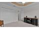 Well-lit bedroom with double door closet and built-in desk at 4318 St Stephen St, The Villages, FL 32163