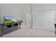 Bedroom with TV stand, large closet, and access to bathroom at 4318 St Stephen St, The Villages, FL 32163