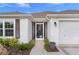 Front entrance with screen door and landscaping at 4318 St Stephen St, The Villages, FL 32163