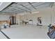 Spacious garage with epoxy flooring and extra storage at 4318 St Stephen St, The Villages, FL 32163
