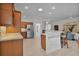 Kitchen with wood cabinets, stainless steel appliances and breakfast bar at 4318 St Stephen St, The Villages, FL 32163