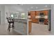 Open concept kitchen with island and stainless steel appliances at 4318 St Stephen St, The Villages, FL 32163