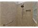 Modern shower with tile surround and glass block accents at 4318 St Stephen St, The Villages, FL 32163