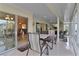 Spacious sunroom with game table and access to main living areas at 4318 St Stephen St, The Villages, FL 32163