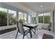 Sunroom with ample natural light, perfect for games or relaxation at 4318 St Stephen St, The Villages, FL 32163
