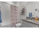 Bathroom with tub shower combo, granite countertop, and neutral tile at 5300 Sunshine Dr, Wildwood, FL 34785