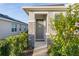 Inviting front entry with stone accents and landscaping at 5300 Sunshine Dr, Wildwood, FL 34785
