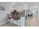 Contemporary kitchen featuring granite countertops and breakfast bar at 5300 Sunshine Dr, Wildwood, FL 34785