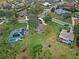 An aerial view showcasing the home's location within the neighborhood and surrounding properties at 5318 Greens Dr, Lady Lake, FL 32159