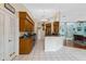 Spacious kitchen with wood cabinets, stainless steel appliances, and breakfast bar at 5318 Greens Dr, Lady Lake, FL 32159