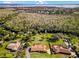 Aerial view of a house with a pool and large lot near the water at 5351 Magnolia Ridge Rd, Fruitland Park, FL 34731