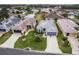 Aerial view of homes in a residential neighborhood at 5806 Woodland Moss Way, Leesburg, FL 34748