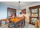 Dining area with charming wood furniture and stylish light fixture at 606 N Shore Dr, Leesburg, FL 34748