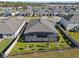 Aerial view showcasing a house with a large backyard and screened enclosure at 771 Annabell Ridge Rd, Minneola, FL 34715