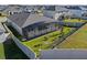 Aerial view of a house with a large backyard, screened pool enclosure and fenced yard at 771 Annabell Ridge Rd, Minneola, FL 34715