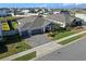 Aerial view of a single-Gathering home with a three-car garage and landscaped yard at 771 Annabell Ridge Rd, Minneola, FL 34715