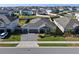 Aerial view of a house with a three-car garage and nicely landscaped yard at 771 Annabell Ridge Rd, Minneola, FL 34715