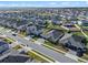 Aerial view of a residential neighborhood, showcasing a house with a three-car garage at 771 Annabell Ridge Rd, Minneola, FL 34715