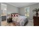 Cozy bedroom with a comfortable bed and built-in shelving at 771 Annabell Ridge Rd, Minneola, FL 34715