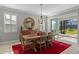 Dining area with wood table and chairs, access to backyard at 771 Annabell Ridge Rd, Minneola, FL 34715