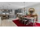 Spacious kitchen with gray cabinets, quartz countertops, and stainless steel appliances at 771 Annabell Ridge Rd, Minneola, FL 34715