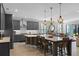 Modern kitchen with gray cabinets, large island, and stainless steel appliances at 771 Annabell Ridge Rd, Minneola, FL 34715