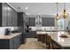 Sleek kitchen with gray cabinetry, quartz countertops, and ample counter space at 771 Annabell Ridge Rd, Minneola, FL 34715