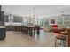 Open kitchen with island, gray cabinets, and stainless steel appliances at 771 Annabell Ridge Rd, Minneola, FL 34715