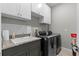 Convenient laundry room with washer, dryer, and extra storage at 771 Annabell Ridge Rd, Minneola, FL 34715