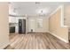 Modern kitchen with stainless steel appliances and light wood flooring at 811 Saint Andrews Blvd, The Villages, FL 32159