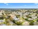 Aerial view of a house and surrounding neighborhood at 9199 Se 171St Cooper Loop, The Villages, FL 32162