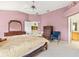 Main bedroom with wooden furniture and ensuite access at 9199 Se 171St Cooper Loop, The Villages, FL 32162