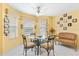 Cozy breakfast nook features a glass-top table and seating for four at 9199 Se 171St Cooper Loop, The Villages, FL 32162