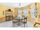 Breakfast nook with glass table and wrought iron chairs at 9199 Se 171St Cooper Loop, The Villages, FL 32162