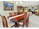 Spacious dining room with a large wooden table and six chairs at 9199 Se 171St Cooper Loop, The Villages, FL 32162