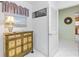 Inviting entryway with decorative cabinet at 9199 Se 171St Cooper Loop, The Villages, FL 32162