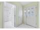 Bright entryway with white doors and tiled floor at 9199 Se 171St Cooper Loop, The Villages, FL 32162