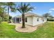 House exterior showcasing a well-maintained yard at 9199 Se 171St Cooper Loop, The Villages, FL 32162
