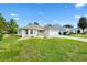 House exterior with landscaping and a walkway at 9199 Se 171St Cooper Loop, The Villages, FL 32162