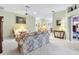 Living room with floral sofa and chairs, and access to backyard at 9199 Se 171St Cooper Loop, The Villages, FL 32162