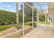 Relaxing screened patio with view of backyard at 9199 Se 171St Cooper Loop, The Villages, FL 32162