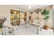 Relaxing sunroom with glass doors and seating at 9199 Se 171St Cooper Loop, The Villages, FL 32162