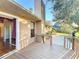 Deck with access to home interior and backyard at 9835 Lakeshore Dr, Clermont, FL 34711