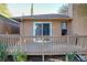 Elevated deck with a view of the house exterior at 9835 Lakeshore Dr, Clermont, FL 34711