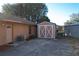 Backyard with detached shed and partial lake view at 9835 Lakeshore Dr, Clermont, FL 34711