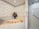 Bathroom with corner bathtub and shower at 9835 Lakeshore Dr, Clermont, FL 34711