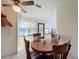 Charming breakfast nook with lake views and wooden chairs at 9835 Lakeshore Dr, Clermont, FL 34711