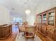 Bright dining room featuring a wood table and hutch at 9835 Lakeshore Dr, Clermont, FL 34711